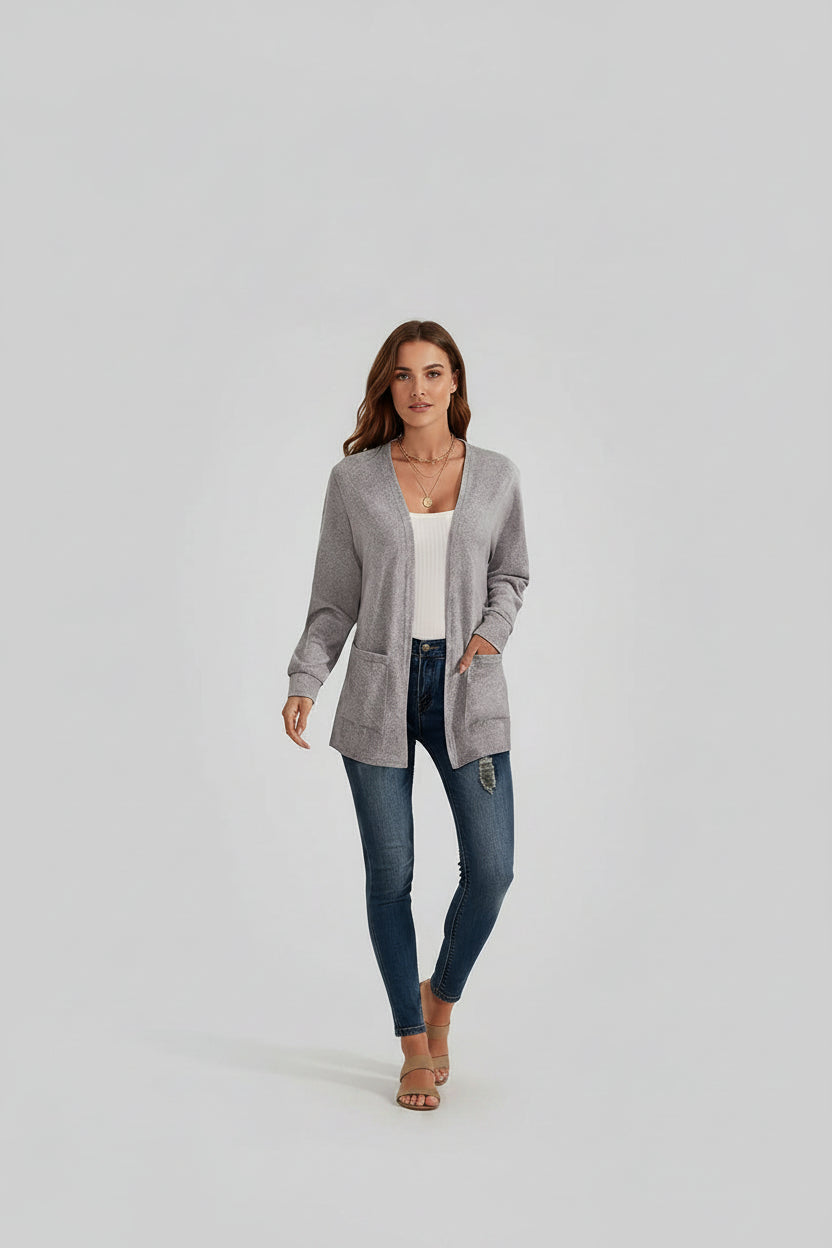 Gray cardigan worn by a person with additional cardigans in different colors displayed in the background.