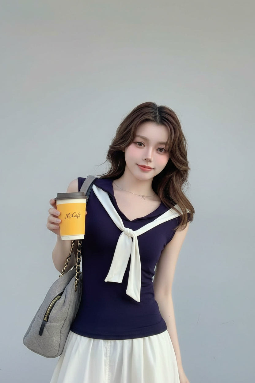 Woman holding a coffee cup in an indoor setting