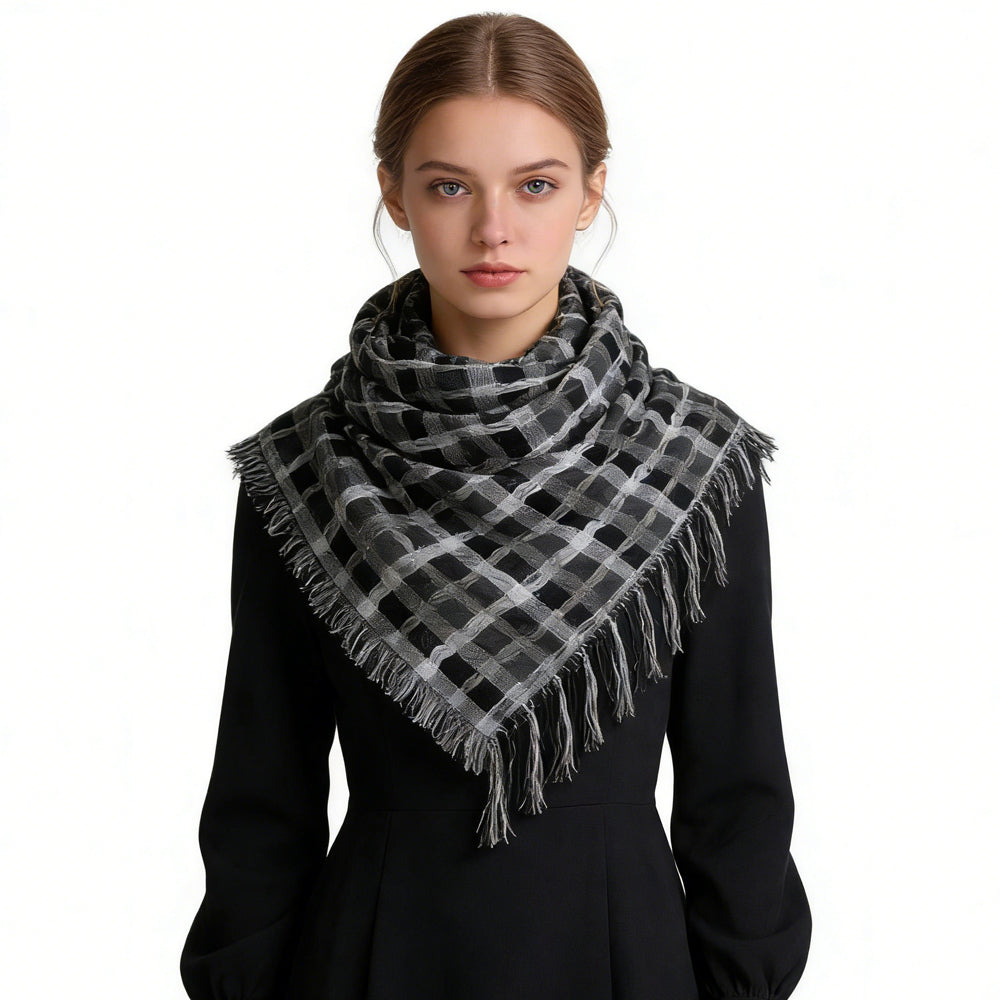 Woman wearing a black and gray checkered scarf on a white background